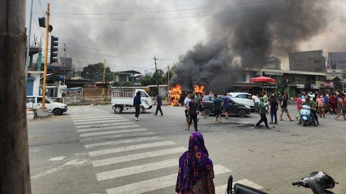 Vehicles set ablaze along Airport Road in Imphal, Thursday | Karishma Hasnat | ThePrint