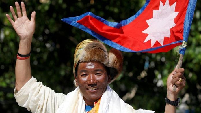 epali mountaineer Kami Rita Sherpa waves upon his arrival after climbing Mount Everest for the 24th time in 2019, setting a record for the most summits of the world's highest mountain, in Kathmandu, Nepal on 25 May, 2019 | Reuters