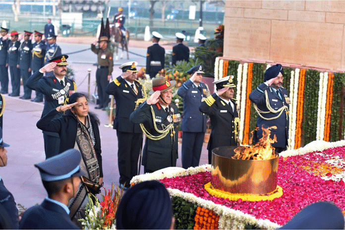 New Delhi: Former Army Chief General Bipin Rawat pays tribute to the martyrs of Indo-Pakistani War of 1971 on the occasion of Vijay Diwas, at India Gate in New Delhi | PTI Photo by Arun Sharma(PTI12_16_2017_000064B)