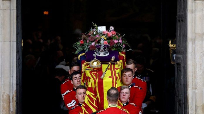 The coffin of Britain's Queen Elizabeth is carried out of Westminster Abbey after a service on the day of her state funeral and burial, in London, on 19 September 2022 | Reuters