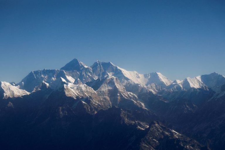 Renowned US mountaineer climbs rare Everest ‘triple crown’