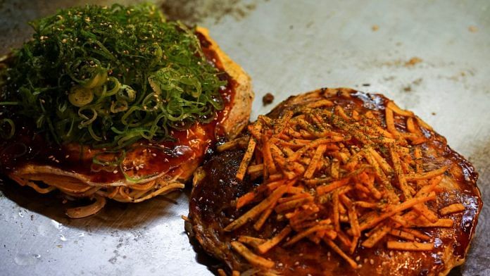 Okonomiyaki are seen at a okonomiyaki specialty chain Chinchikurin restaurant in Hiroshima | Reuters