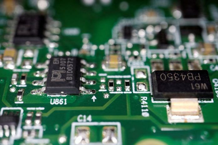 Semiconductor chips are seen on a printed circuit board in this illustration | Reuters