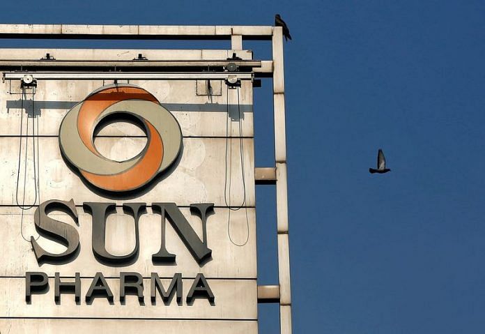 A bird flies past the logo of Sun Pharma installed on the facade of its corporate office in Mumbai | Reuters file photo