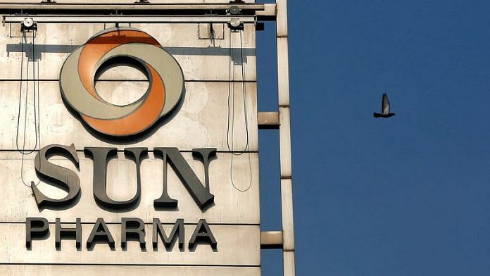 A bird flies past the logo of Sun Pharma installed on the facade of its corporate office in Mumbai | File Photo: Reuters