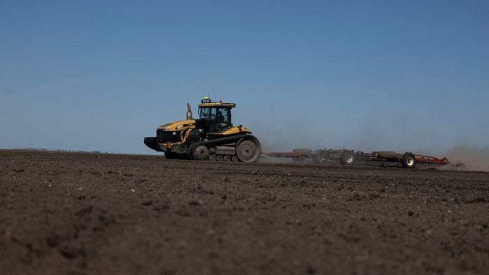 An agricultural worker operates a tractor with a tiller in a field near the village Kyshchentsi, amid Russia's attack on Ukraine, in Cherkasy region, Ukraine | File Photo: Reuters