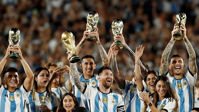 Argentina's Lionel Messi and teammates celebrate with their families and World Cup trophies after the match | Reuters file photo
