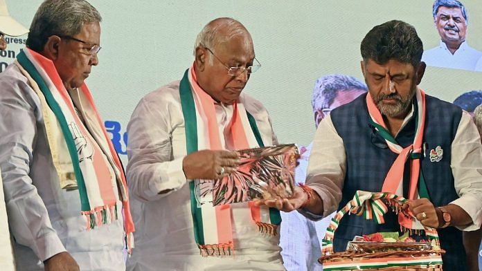AICC President Mallikarjun Kharge (centre) and party leaders Siddaramaiah (left) and DK Shivakumar release party's manifesto for the upcoming Karnataka assembly elections | ANI