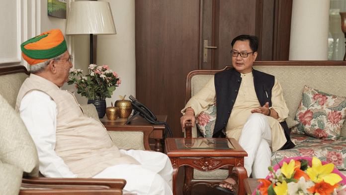 Former law minister Kiren Rijiju speaks with his predecessor Arjun Ram Meghwal in New Delhi on Thursday | Twitter | @arjunrammeghwal