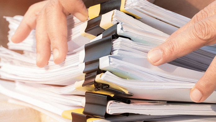 Representational photo of documents being searched | Pic courtesy: Pxfuel