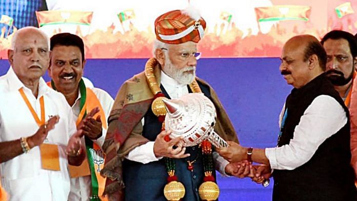 Representational image | File photo of Prime Minister Narendra Modi being felicitated by Karnataka CM Basavaraj Bommai | ANI