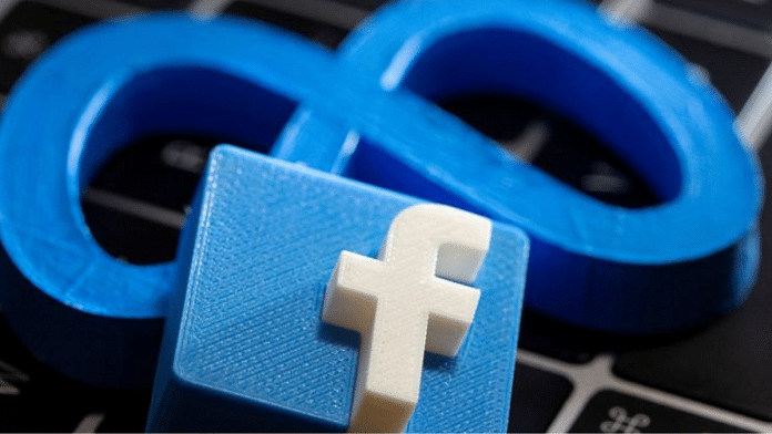 A 3D printed Facebook's new rebrand logo Meta and Facebook logo are placed on laptop keyboard in this illustration | Reuters