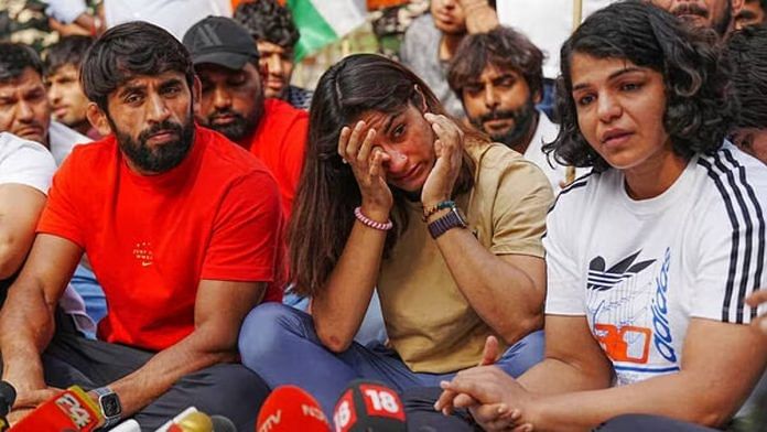 Bajrang Punia, Vinesh Phogat and Sakshi Malik at a press conference on the wrestlers’ protest at Jantar Mantar in New Delhi on 23 April | Photo: PTI