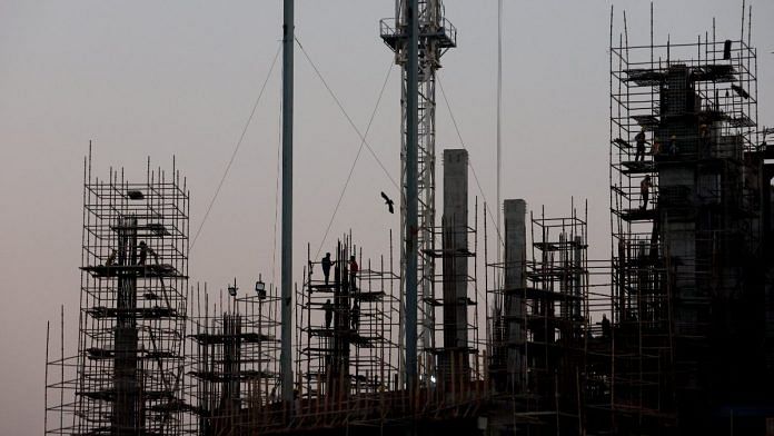 Labourers work at the construction site of a commercial building in New Delhi | Reuters/Anushree Fadnavis