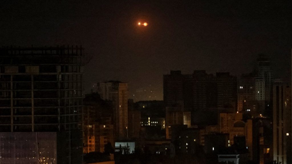 An explosion of a drone is seen in the sky over the city during a Russian drone strike in Kyiv, on 25 May 2023 | Reuters/Gleb Garanich