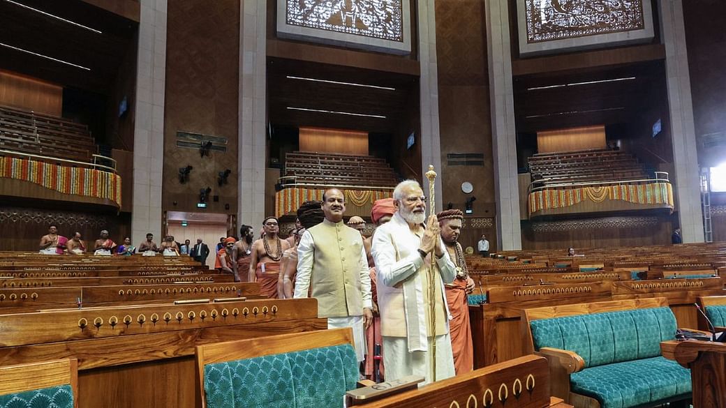 Prime Minister Narendra Modi carries the 'Sengol' to install it at the new Parliament building in New Delhi, Sunday | Photo: ANI