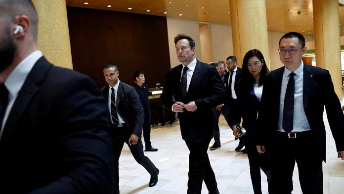 Tesla Chief Executive Officer Elon Musk leaves a hotel in Beijing | Reuters