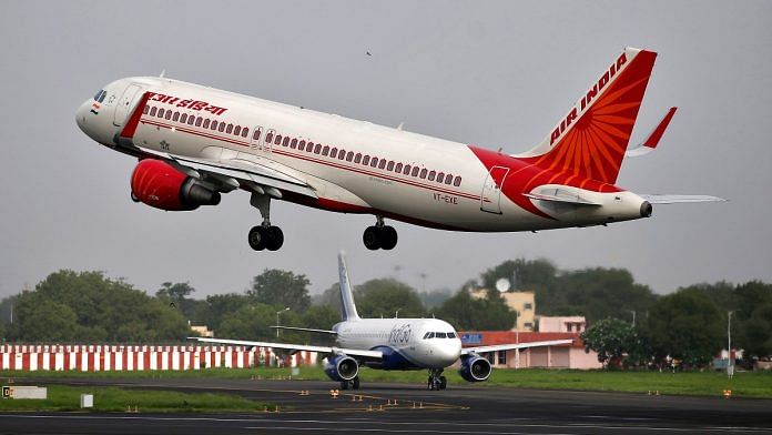 An Air India Airbus A320-200 aircraft takes off as an IndiGo Airlines aircraft waits for clearance at the Sardar Vallabhbhai Patel International Airport in Ahmedabad | Reuters