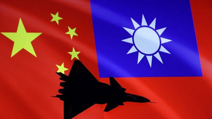 Airplane is seen in front of Chinese and Taiwanese flags in this illustration | Reuters