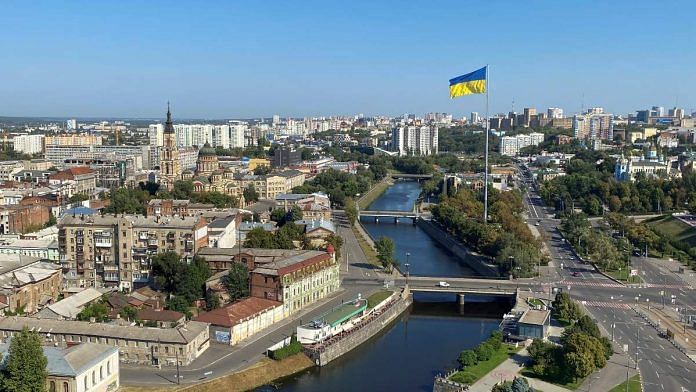 Ukraine's national flag waves in central Kharkiv during a long curfew, as Russia's attack on Ukraine continues | Reuters