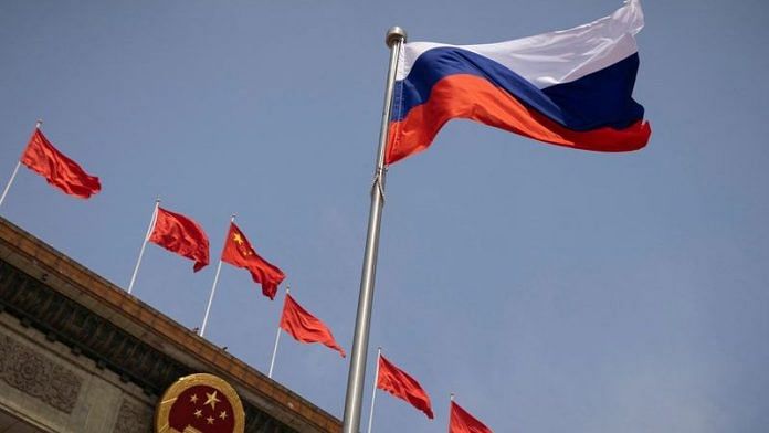 The Russian national flag flies in front of the Great Hall of the People before a welcoming ceremony for Russian Prime Minister Mikhail Mishustin in Beijing, China, May 24, 2023 | Reuters