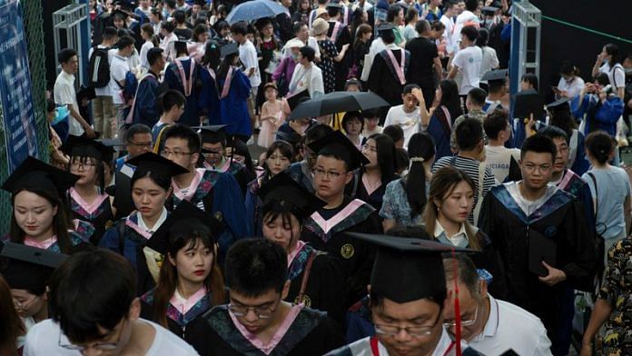 Graduates, including students who could not attend last year due to the coronavirus disease (COVID-19) pandemic, attend a graduation ceremony at Central China Normal University in Wuhan, Hubei province, China on 13 June, 2021/Reuters