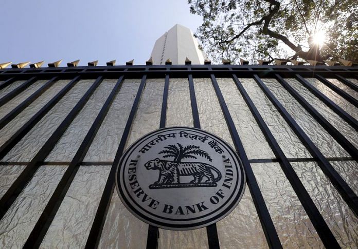 The Reserve Bank of India (RBI) seal is pictured on a gate outside the RBI headquarters in Mumbai | Reuters
