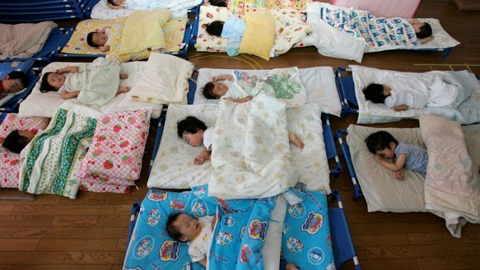 Nursery school children take a nap at Hinagiku nursery in Moriyama, western Japan/File Photo: Reuters