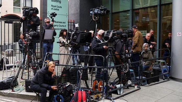 Media wait outside the Rolls Building of the High Court on the day, when Britain's Prince Harry, Duke of Sussex is set to arrive, in London | Reuters/Hannah McKay