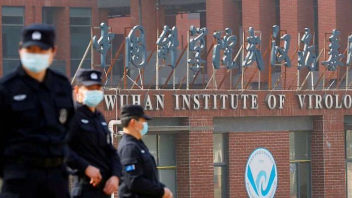 Security personnel keep watch outside the Wuhan Institute of Virology during the visit by the World Health Organization (WHO) team tasked with investigating the origins of the coronavirus disease (COVID-19), in Wuhan, Hubei province, China | Reuters/Thomas Peter/File Photo