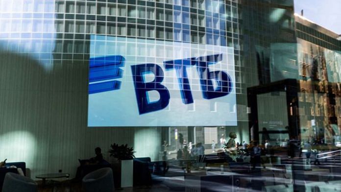 A VTB bank logo is seen on screen through a window in the Moscow International Business Center/File Photo: Reuters