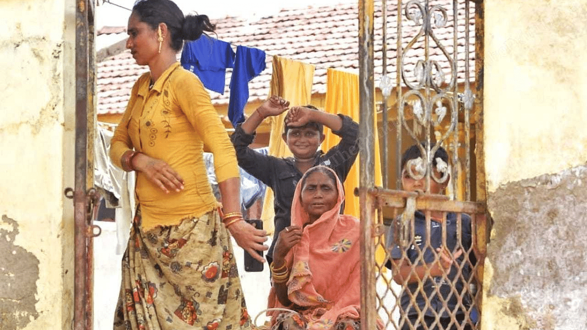 Sonal (in yellow) outside her home | Praveen Jain | ThePrint