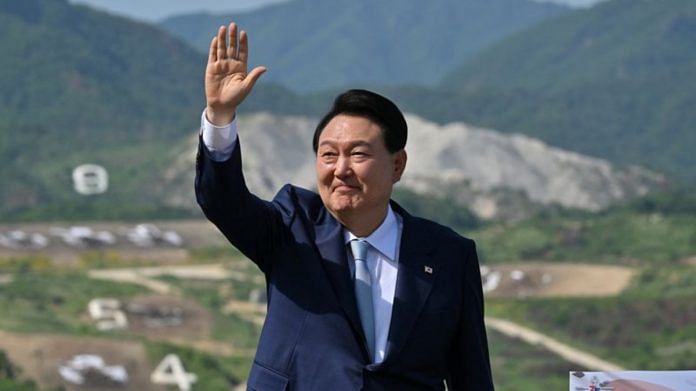 South Korean President Yoon Suk Yeol waves as he delivers a speech after a South Korea-US joint military drill at Seungjin Fire Training Field in Pocheon, South Korea | Reuters