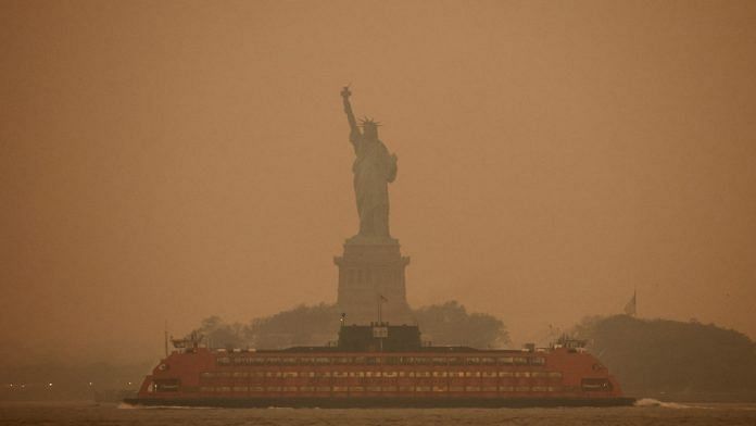 The Statue of Liberty is covered in haze and smoke caused by wildfires in Canada, in New York on 6 June 2023 | Reuters/Amr Alfiky