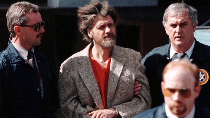 Theodore Kaczynski led out of federal court where he was charged with a single federal weapons violation April 4,1997 | Reuters file