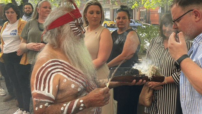 A Kaurna elder, Uncle Moogy, performs a traditional smoking ceremony with spectators in Australia REUTERS/Jill Gralow/File photo