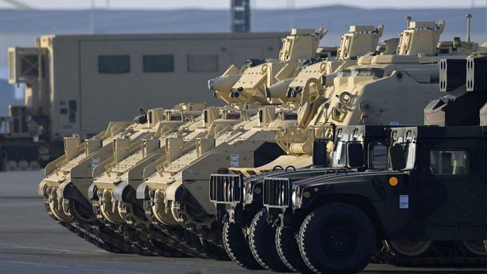 Bradley Fighting Vehicles of the U.S. army get offloaded from cargo vessel ARC Integrity, after their arrival at the harbour in Bremerhaven, Germany | Reuters/Fabian Bimmer/File Photo