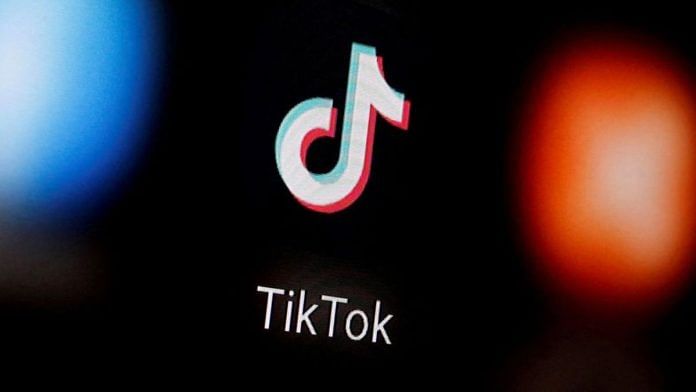 A TikTok logo is displayed on a smartphone in this illustration | Reuters