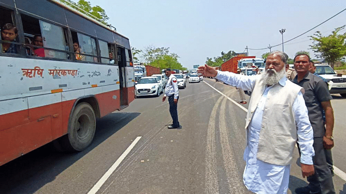 File photo of Haryana Home Minister Anil Vij looking out for heavy vehicles that do not follow lane rules on national highway in Ambala | ANI