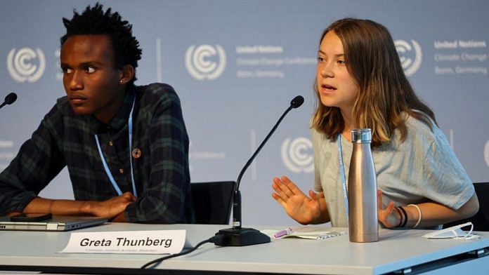 Youth climate justice activists Greta Thunberg and Eric Njuguna attend a press conference on the urgency to put fossil fuel phase-out on the table at the COP28 climate summit later this year in Dubai, in Bonn, Germany | Reuters/Wolfgang Rattay