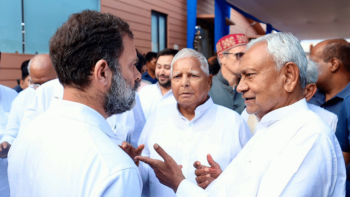 Congress leader Rahul Gandhi interacts with Bihar Chief Minister Nitish Kumar and Rashtriya Janata Dal (RJD) chief Lalu Prasad Yadav after the Opposition leaders' meeting in Patna | ANI