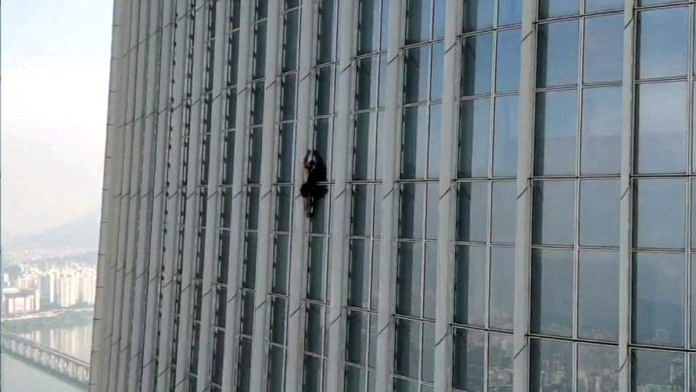 A British man climbs Lotte World Tower in Seoul, South Korea, on 12 June 2023 | South Korea's Songpa Fire Station/Handout via Reuters