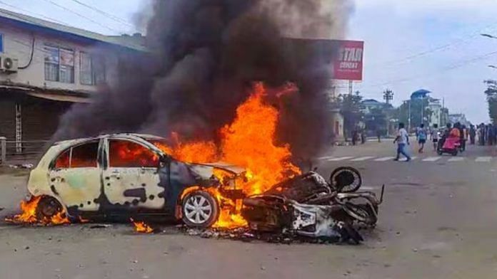 Vehicles in flames after violence broke out during the 'Tribal Solidarity March' called by All Tribal Student Union Manipur (ATSUM), in Imphal. Photo by PTI