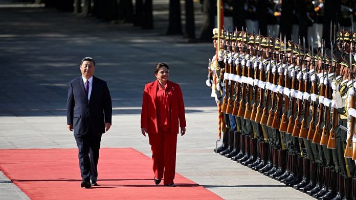 Honduran President Xiomara Castro and Chinese President Xi Jinping inspect Chinese honor guards during a welcome ceremony outside the Great Hall of the People in Beijing | Wang Zhao/Pool via Reuters