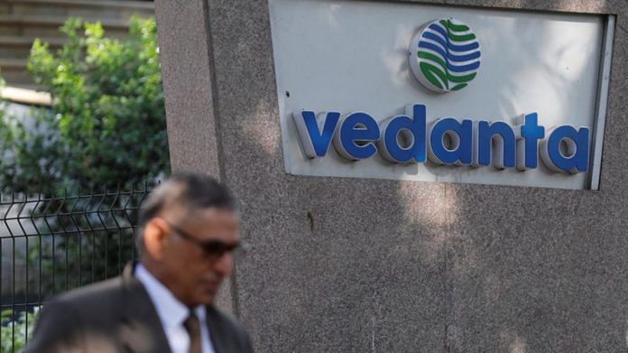 A man walks past the logo of Vedanta outside its headquarters in Mumbai, India | Reuters