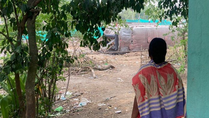 A villager looks at the wreckage of last Friday's train accident from Jyothi Sahu’s house in Bahanaga | Vandana Menon | ThePrint