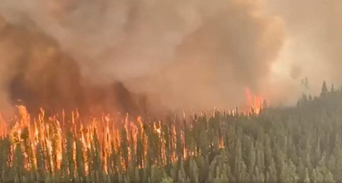 An aerial view shows West Kiskatinaw River wildfire in British Columbia, Canada, on 9 June, 2023 in this screen grab obtained from a social media video/Reuters