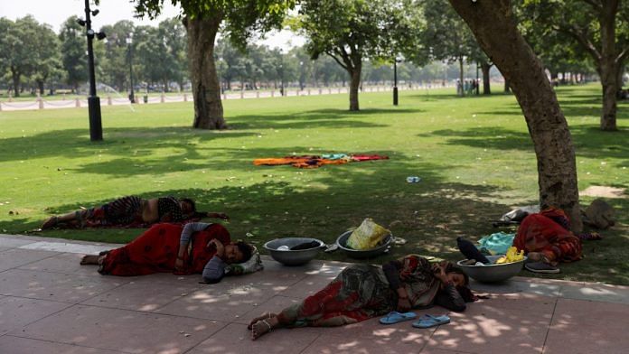 Women labourers rest under a tree on a hot summer day near India Gate, in New Delhi| Reuters/Anushree Fadnavis/File Photo