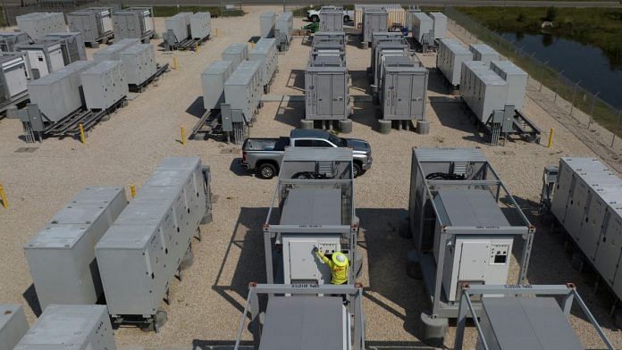 An engineer checks an inverter next to battery banks at an energy storage facility in Sweeny, Texas, US | Representational image | Reuters file photo