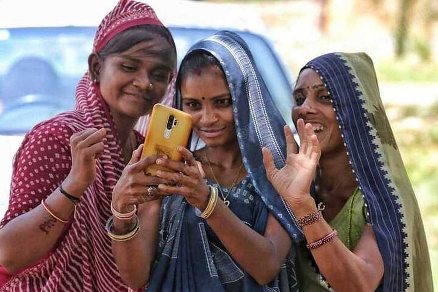 Payal, Komal and Kailash are taking a selfie